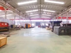 Inside the WeiDong assembly hall: press brake, overhead cranes and 3600-series tub grinder bodies under construction